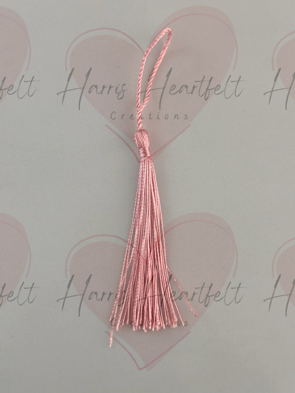 light pink metal bookmark tassel