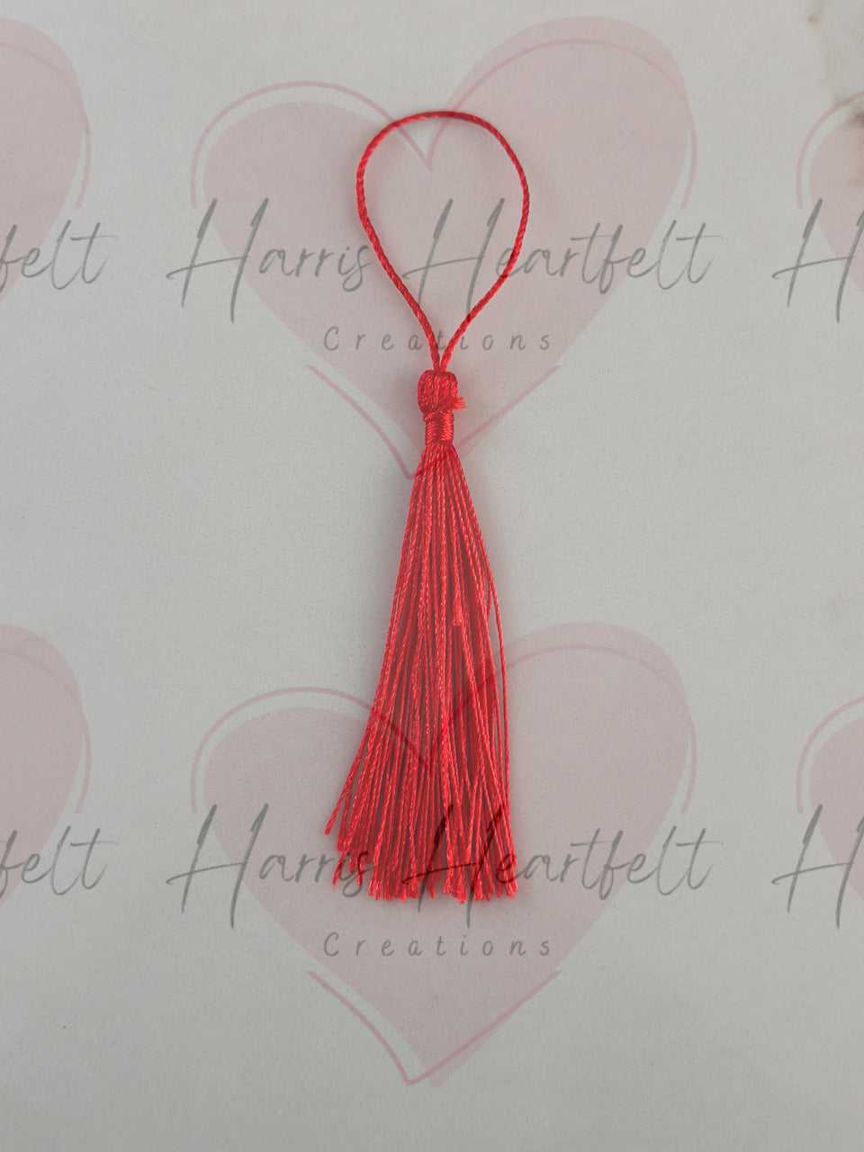 red metal bookmark tassel