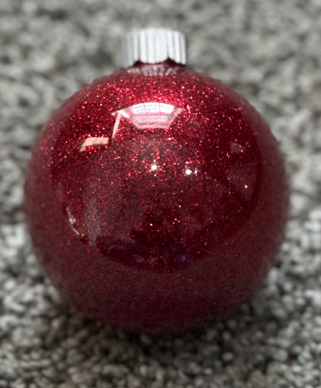 red glittered plastic ornament