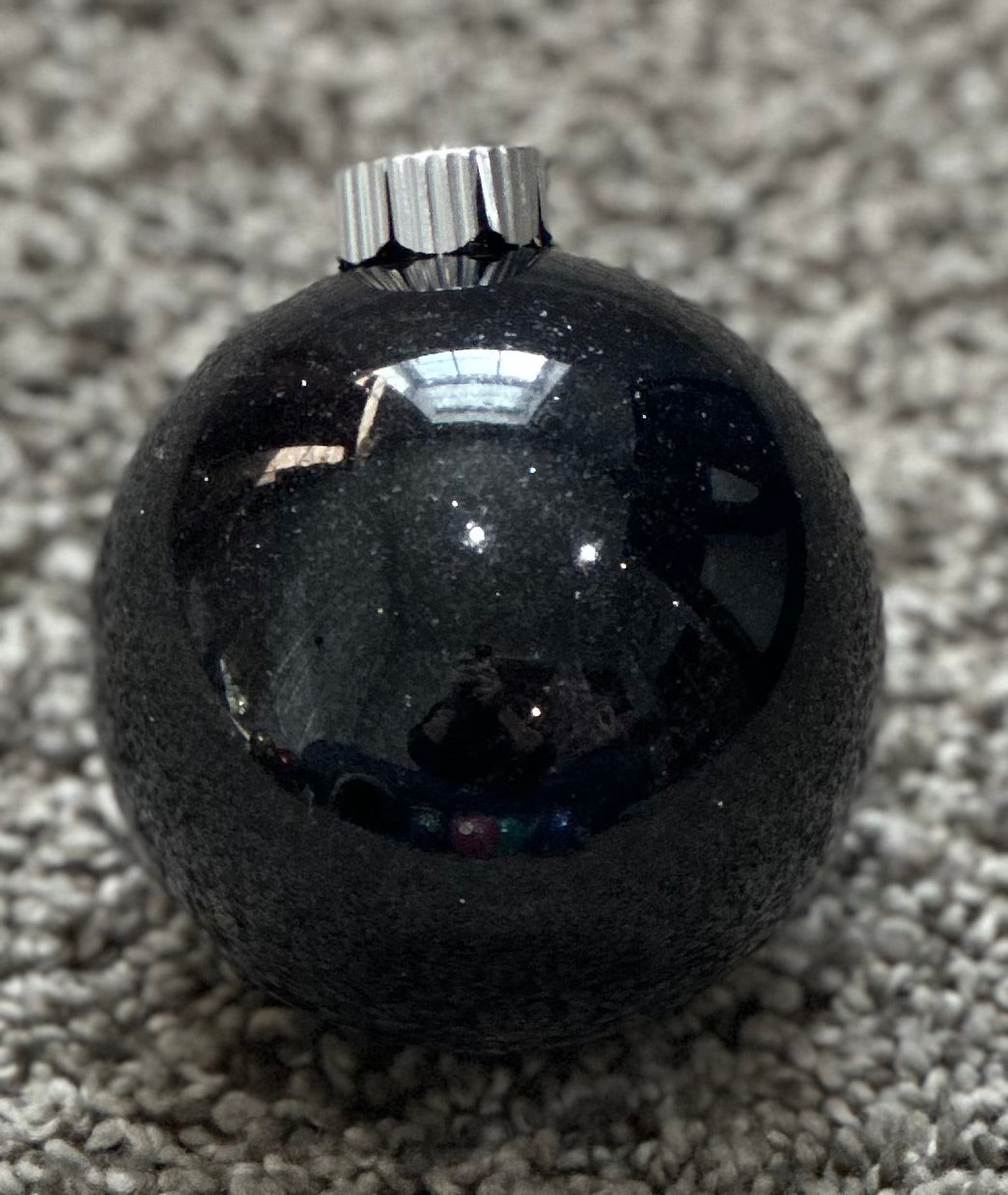 black glittered plastic ornament