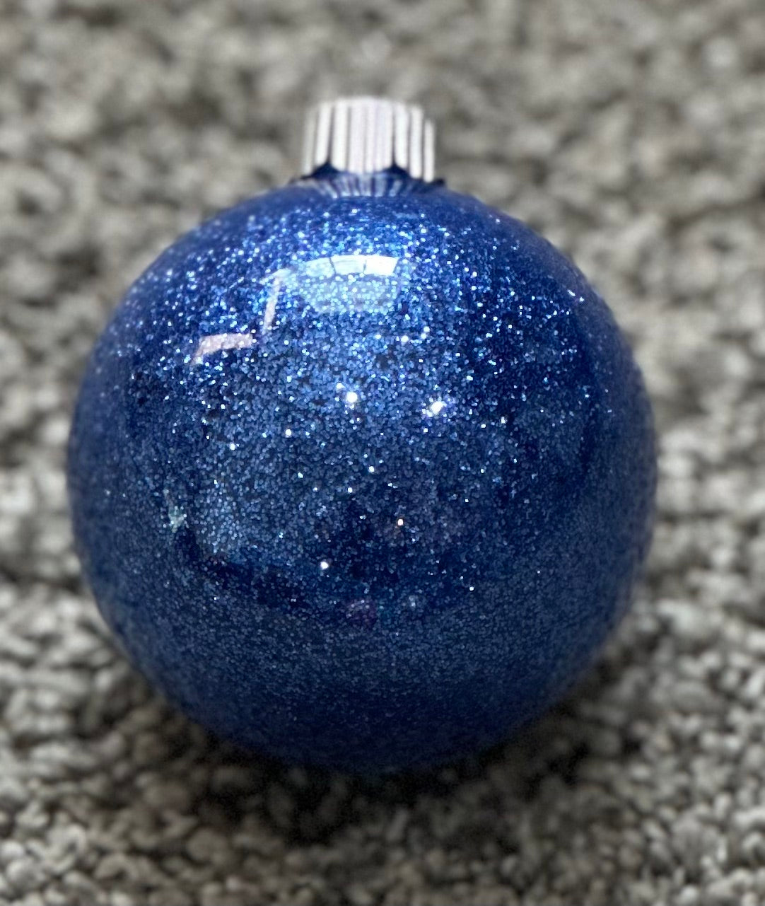 blue glittered plastic ornament