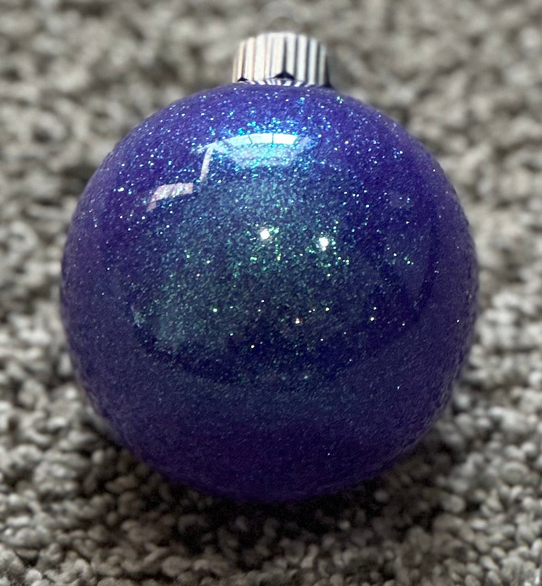 purple glittered plastic ornament