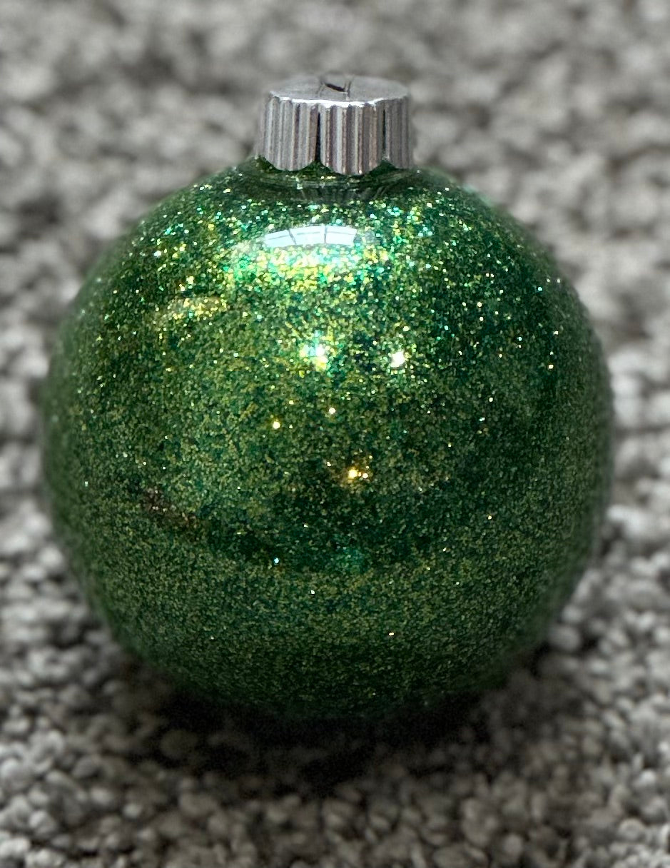 green glittered plastic ornament