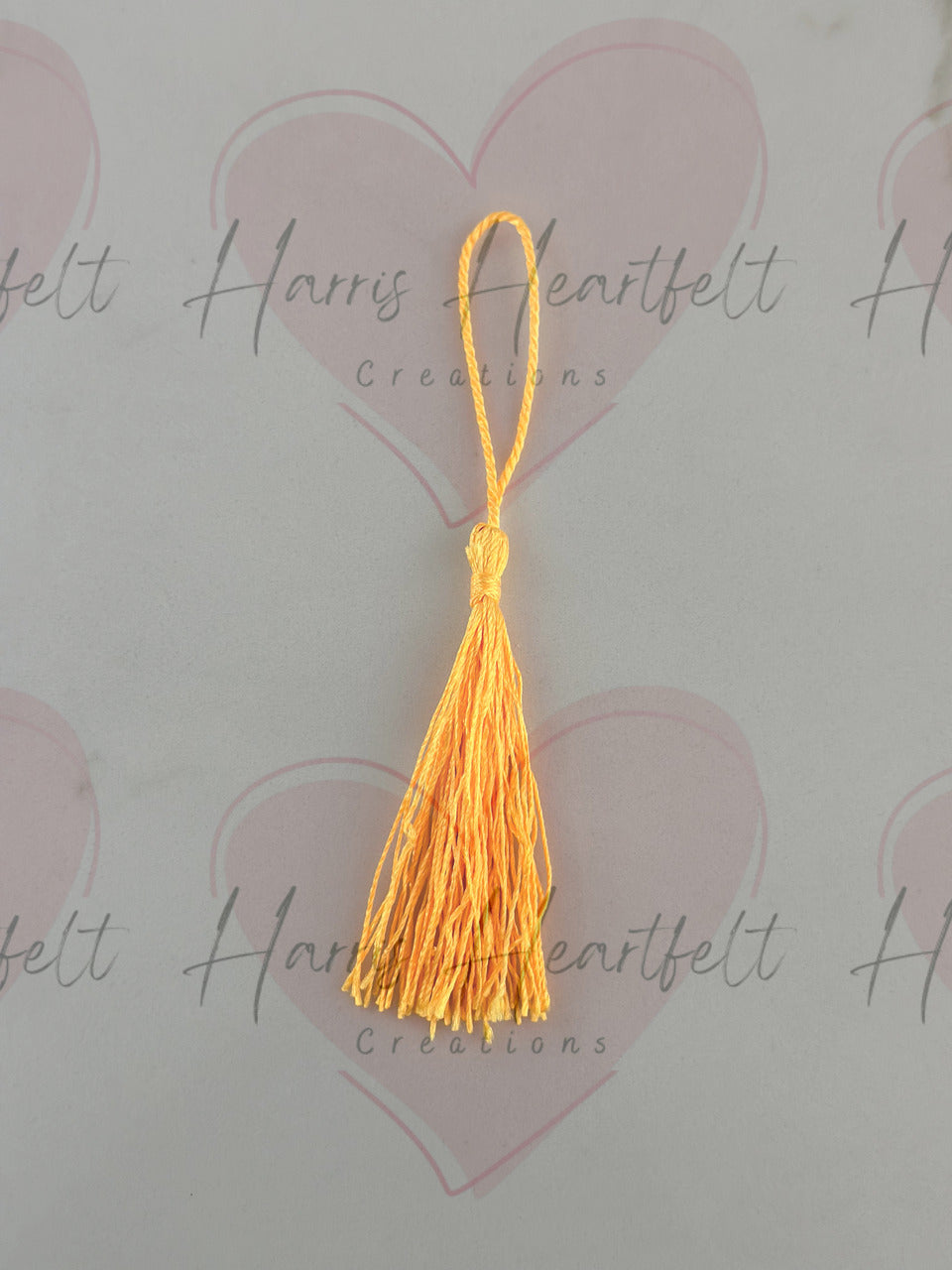 Yellow metal bookmark tassel
