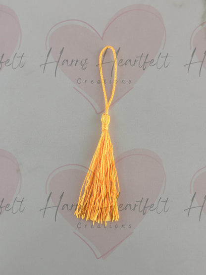 Yellow metal bookmark tassel